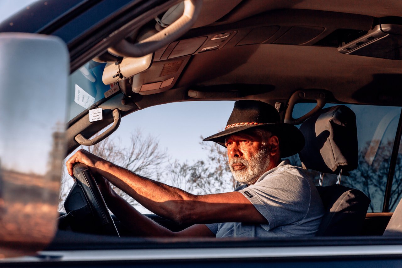 Production photo of Ernie Dingo on the set of Going Places TV show.